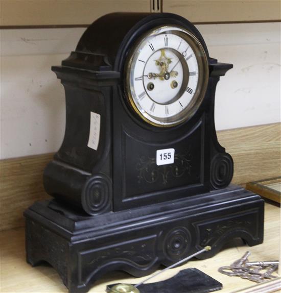 A Victorian black eight day mantel clock